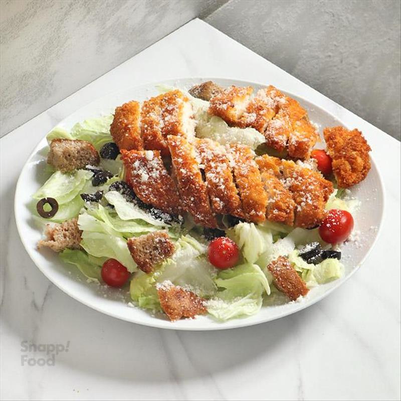 Caesar salad with breaded chicken